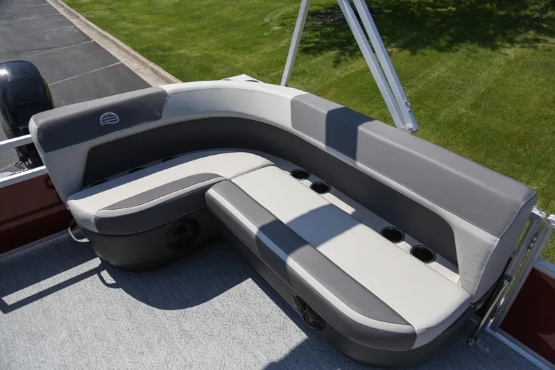 Slide: The Image of 2026 Sun Tracker Bass Buggy 16 XL Select boat seating with cup holders, gray upholstery. - 2