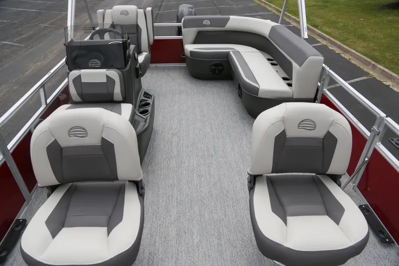 The Image of 2026 Sun Tracker Bass Buggy 16 XL Select pontoon boat interior with plush seating. - 0