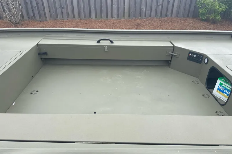 Slide: The Image of 2026 Tracker Grizzly 1654 T Sportsman boat interior with storage and control panel. - 5
