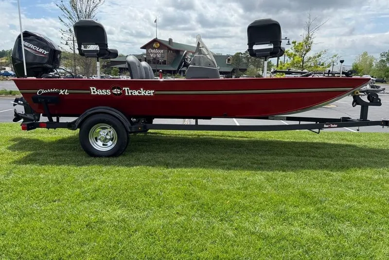 The Image of 2026 Tracker Bass Tracker Classic XL boat on trailer, parked on grass. - 0