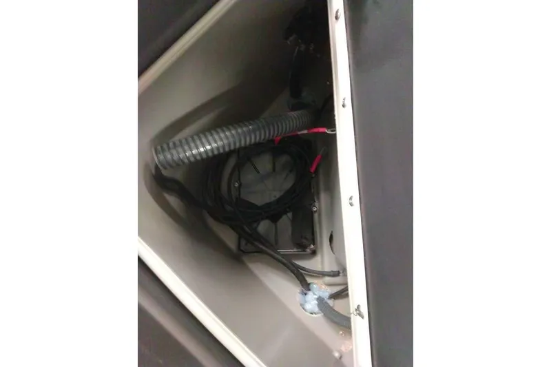 Slide: The Image of Interior wiring of 2026 Sun Tracker Fishin' Barge 20 DLX boat compartment. - 100