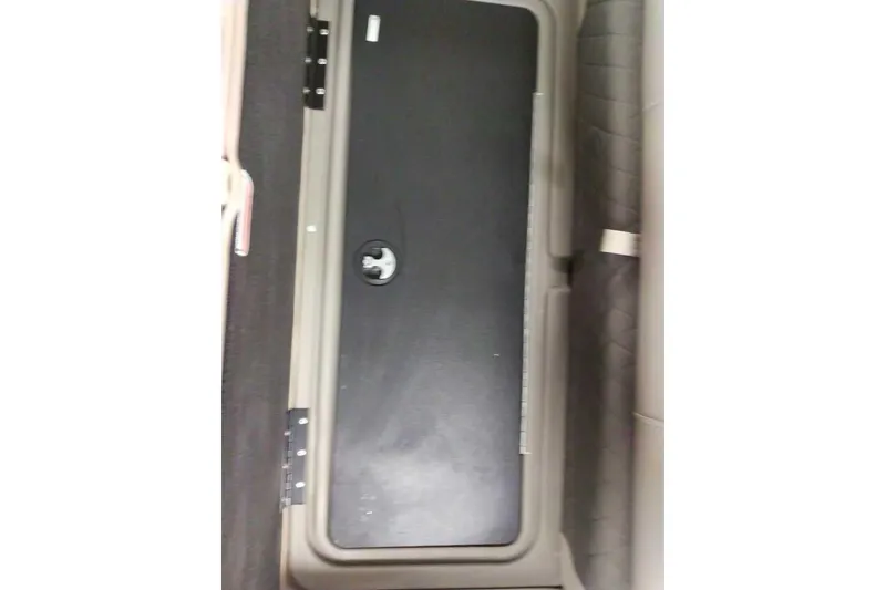 Slide: The Image of Storage compartment on 2026 Sun Tracker Fishin' Barge 20 DLX boat interior. - 103