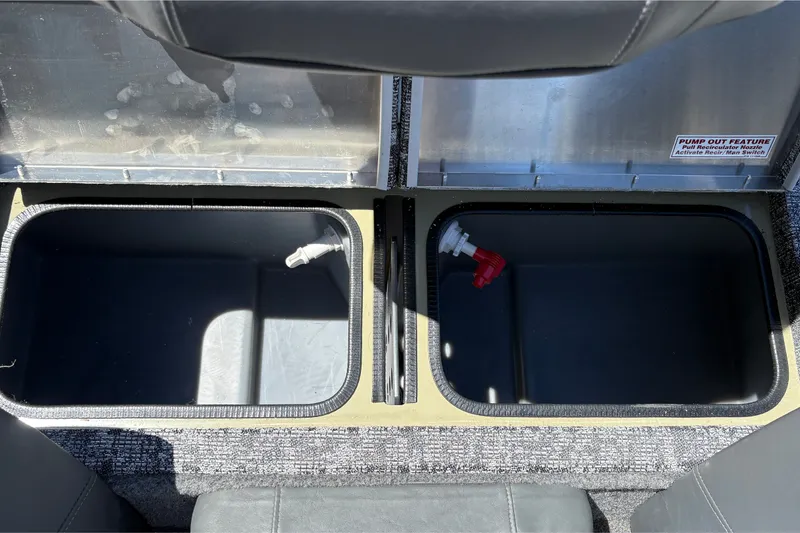 Slide: The Image of Storage compartments in a 2026 Tracker Pro Team 195 boat, featuring pump-out feature. - 25