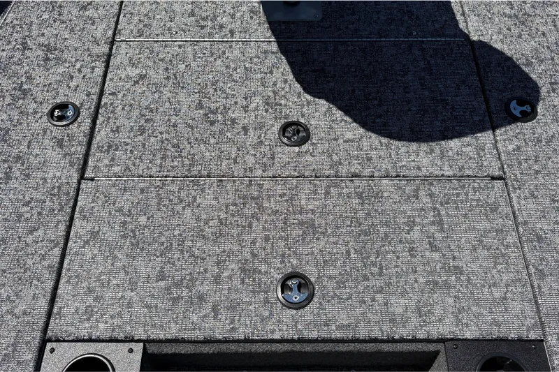 Slide: The Image of Carpeted deck of 2026 Tracker Pro Team 195 boat with storage compartments. - 45