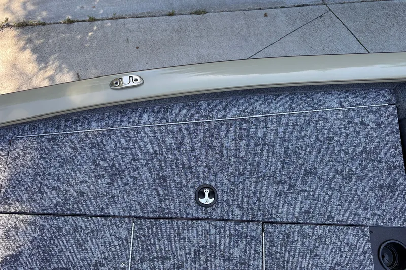 Slide: The Image of 2026 Tracker Pro Team 195 boat deck with textured surface and metal latch. - 41