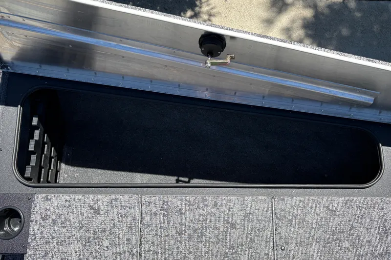 Slide: The Image of Open storage compartment in 2026 Tracker Pro Team 195 boat. - 29