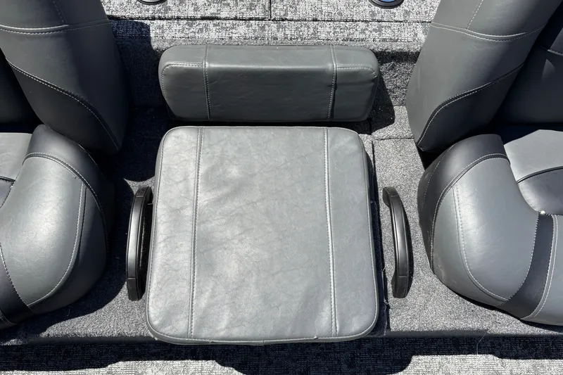 Slide: The Image of 2026 Tracker Pro Team 195 boat interior with gray leather seating and armrests. - 34