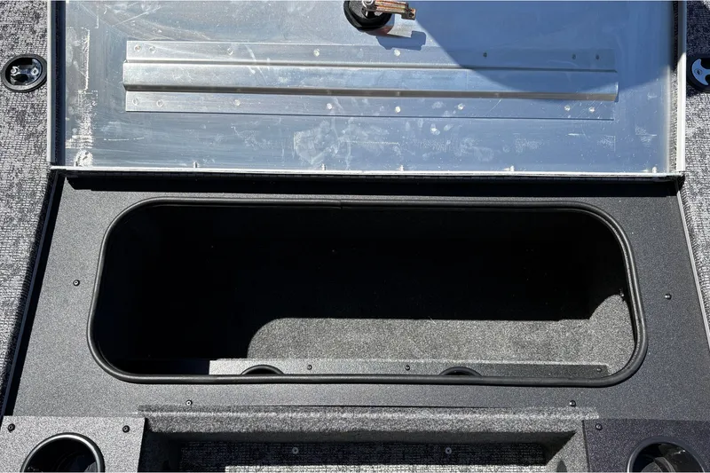 Slide: The Image of Storage compartment of 2026 Tracker Pro Team 195 boat, open and empty. - 35