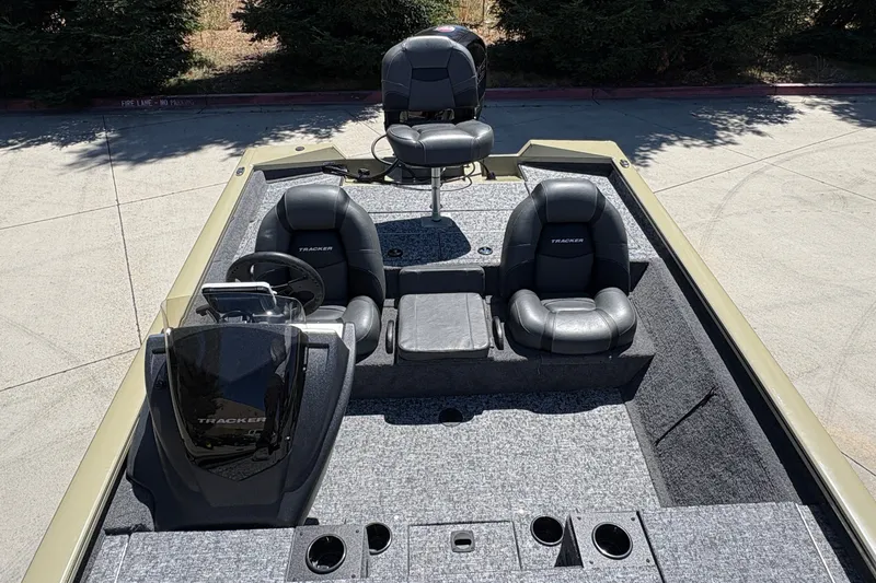 Slide: The Image of 2026 Tracker Pro Team 195 boat interior with seating and steering console. - 17