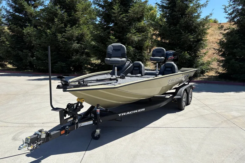 Slide: The Image of 2026 Tracker Pro Team 195 boat on trailer, parked outdoors. - 8
