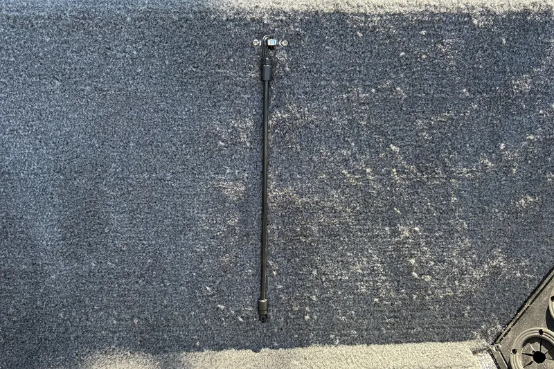 Slide: The Image of Carpeted deck of 2026 Tracker Pro Team 195 boat with mounted rod holder. - 44