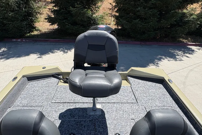 Slide: The Image of 2026 Tracker Pro Team 195 boat with cushioned seating and carpeted deck. - 21
