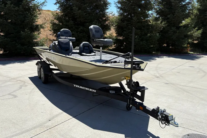 Slide: The Image of 2026 Tracker Pro Team 195 boat on trailer, parked outdoors. - 6