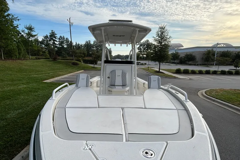 Slide: The Image of 2026 Ranger 2510 Bay boat parked outdoors, showcasing sleek design and spacious deck. - 7