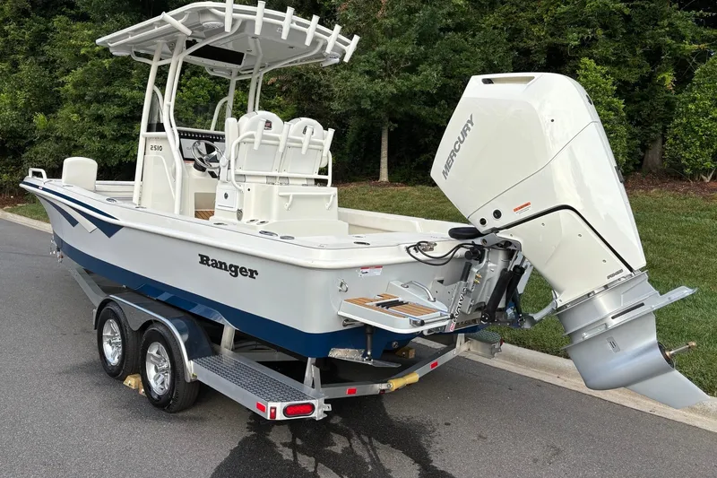 Slide: The Image of 2026 Ranger 2510 Bay boat with Mercury outboard engine on trailer. - 5