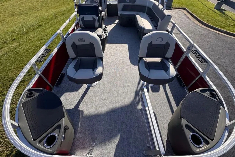 Slide: The Image of 2026 Sun Tracker Bass Buggy 18 DLX pontoon boat interior with seating and storage compartments. - 87