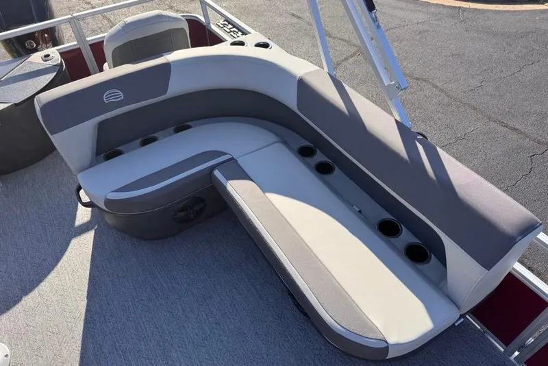 Slide: The Image of 2026 Sun Tracker Bass Buggy 18 DLX boat seating with cup holders, gray upholstery. - 89