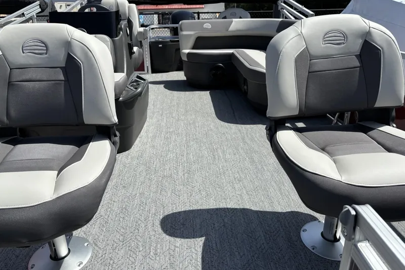 Slide: The Image of 2026 Sun Tracker Bass Buggy 18 DLX interior with comfortable seating and modern design. - 2
