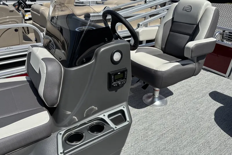 Slide: The Image of 2026 Sun Tracker Bass Buggy 18 DLX interior with steering console and seating. - 6