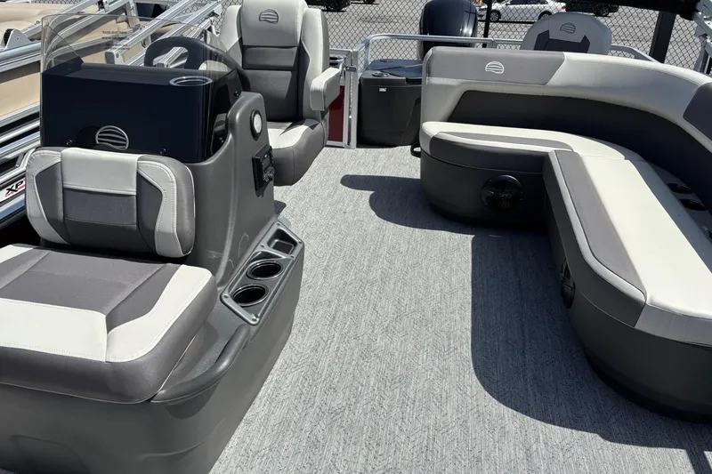 Slide: The Image of 2026 Sun Tracker Bass Buggy 18 DLX interior with seating and steering console. - 5
