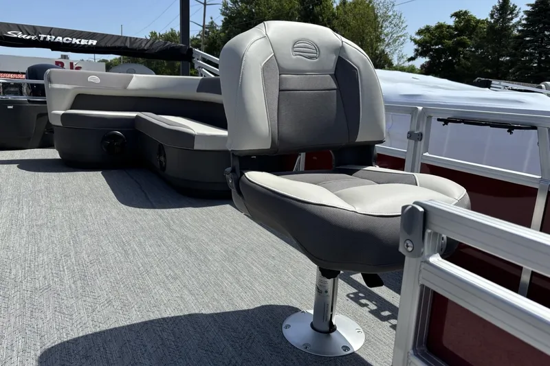 Slide: The Image of 2026 Sun Tracker Bass Buggy 18 DLX pontoon boat with comfortable seating and sleek design. - 4