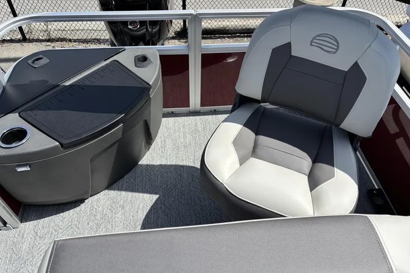 Slide: The Image of 2026 Sun Tracker Bass Buggy 18 DLX interior with seating and console. - 7