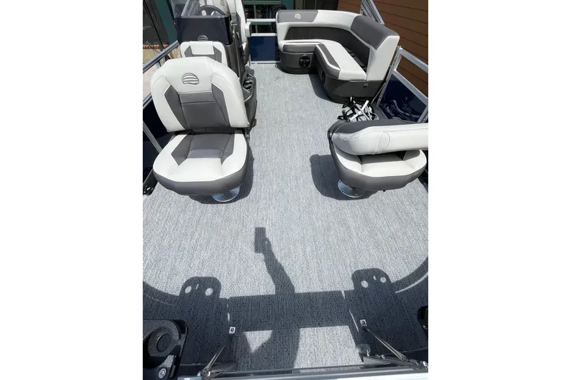 Slide: The Image of 2026 Sun Tracker Bass Buggy 16 XL Select interior with gray seating and spacious layout. - 2