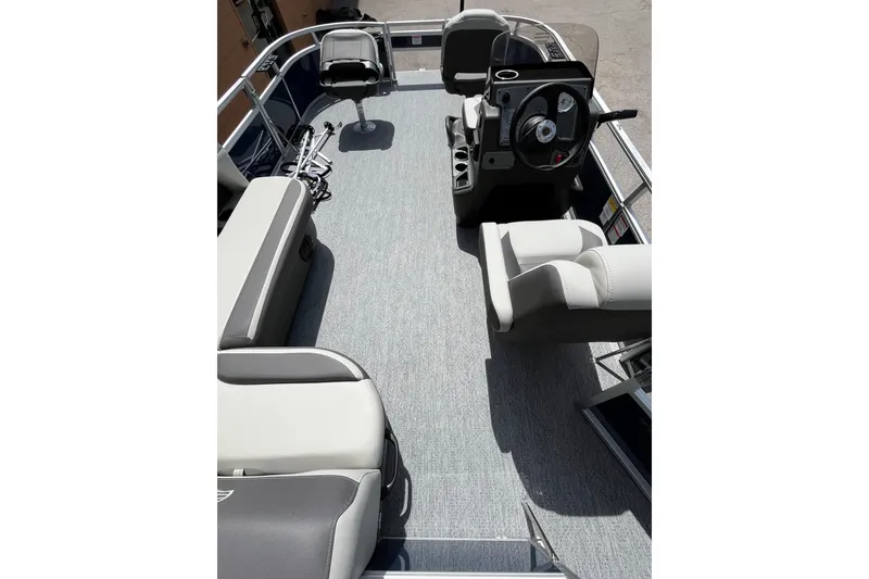 Slide: The Image of 2026 Sun Tracker Bass Buggy 16 XL Select interior with seating and steering console. - 3