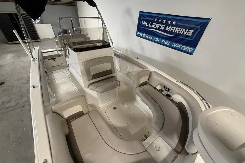 Slide: The Image of 2018 Hurricane boat interior with seating, displayed at Miller's Marine showroom. - 11