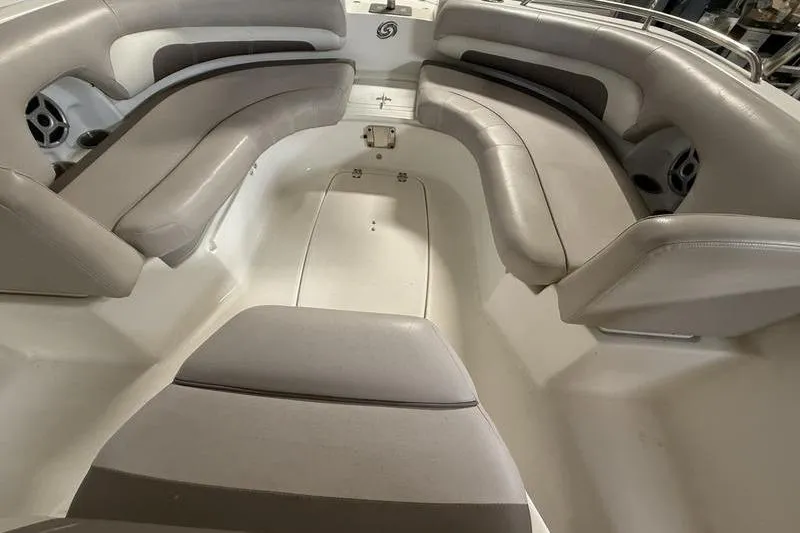 Slide: The Image of 2018 Hurricane boat interior with cushioned seating and storage compartments. - 13