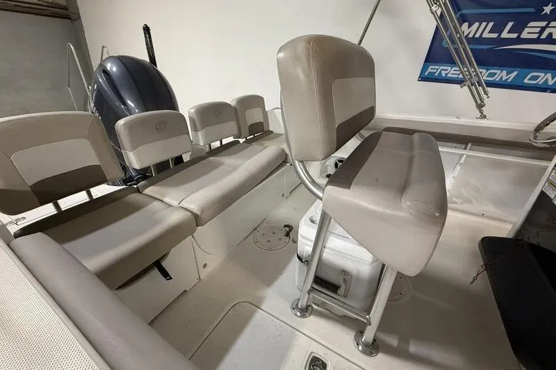 Slide: The Image of Interior of a 2018 Hurricane boat with seating and engine visible. - 4