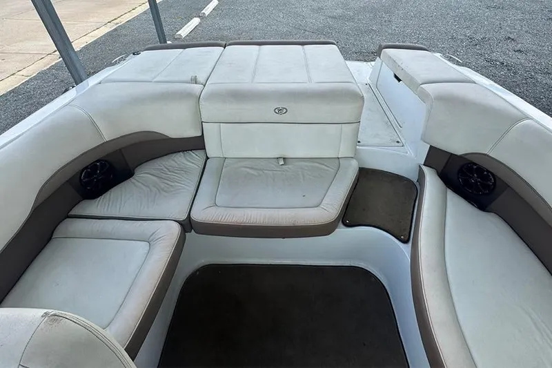 Slide: The Image of 2014 Cobalt 200 boat interior with white and beige seating arrangement. - 10