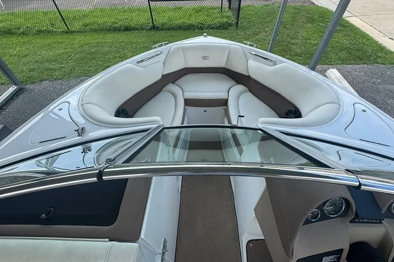 Slide: The Image of Interior view of a 2014 Cobalt 200 boat with white and brown seating. - 12