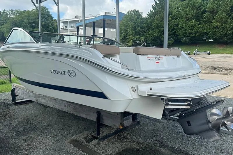 Slide: The Image of 2014 Cobalt 200 boat on display, featuring sleek white design and powerful engine. - 3