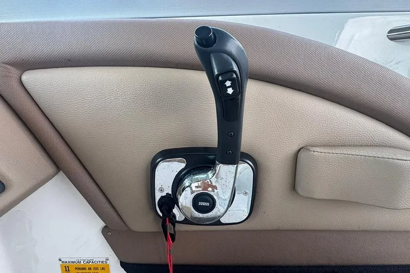 Slide: The Image of Cobalt 200 boat throttle control lever, 2014 model, on beige interior panel. - 8