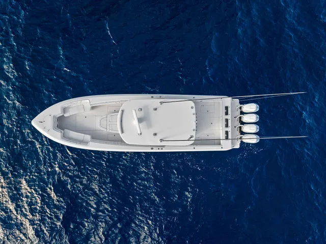 Slide: The Image of 2021 Contender 44 ST boat anchor compartment at dockside, open hatch, sunny day. - 15