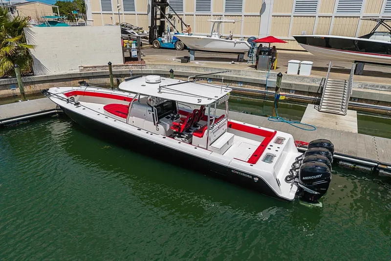 Slide: The Image of 2021 Contender 44 ST boat docked with triple Mercury engines. - 33