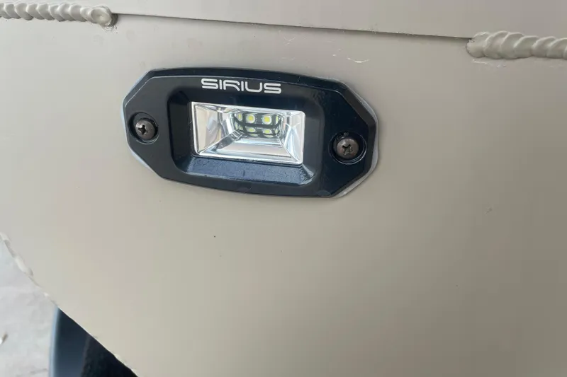 Slide: The Image of Close-up of Sirius light on 2026 Reaper Boats 653 Timber Reaper. - 14