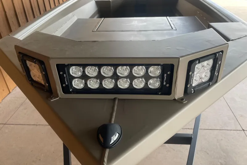 Slide: The Image of 2026 Reaper Boats 653 Timber Reaper with LED lights on the bow. - 3