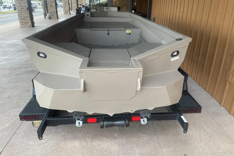 Slide: The Image of 2026 Reaper Boats 653 Timber Reaper on trailer, displayed outdoors. - 8