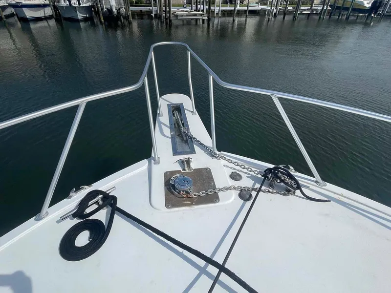 Slide: The Image of Bow of 1998 Viking 50 Convertible yacht with anchor chain and ropes. - 18