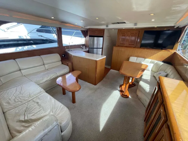 Slide: The Image of Luxurious interior of 1998 Viking 50 Convertible yacht with leather seating and modern amenities. - 5