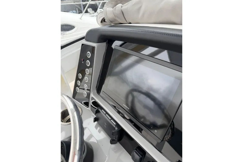 Slide: The Image of 2024 Robalo R250 Center Console dashboard with Garmin display and control panel. - 12