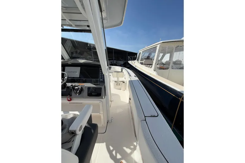 Slide: The Image of 2024 Robalo R250 Center Console boat interior with Garmin navigation system. - 15