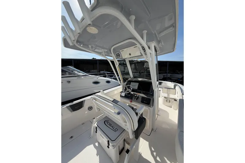Slide: The Image of 2024 Robalo R250 Center Console boat interior with helm and seating. - 7