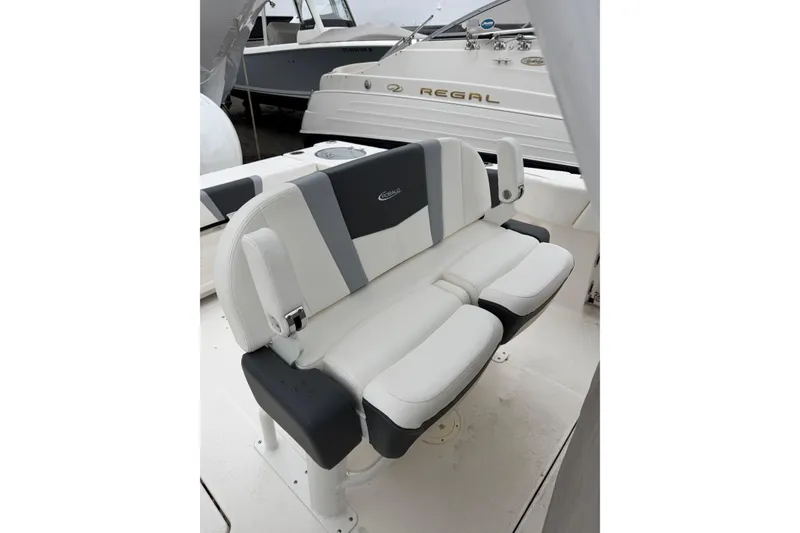 Slide: The Image of 2024 Robalo R250 Center Console boat seating, featuring sleek white and gray upholstery. - 8