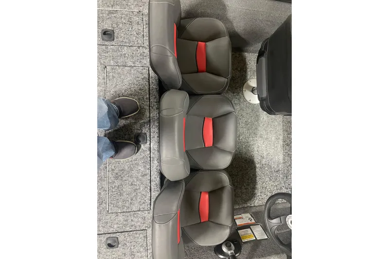 Slide: The Image of 2026 Tracker Pro Team 175 Crappie Edition boat seats with gray and red design. - 11