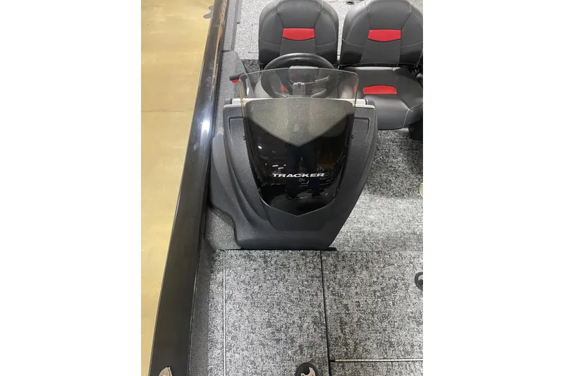 Slide: The Image of 2026 Tracker Pro Team 175 Crappie Edition boat interior with steering console and seating. - 14