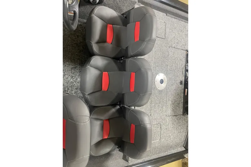 Slide: The Image of 2026 Tracker Pro Team 175 Crappie Edition boat interior with gray and red seating. - 16