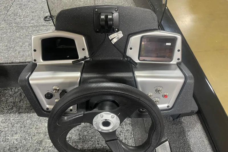 Slide: The Image of Steering console of 2026 Tracker Pro Team 175 Crappie Edition boat with controls and displays. - 19